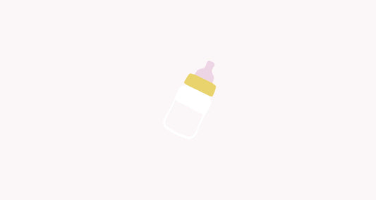 What I wish I knew about breastfeeding before having a baby - Baby milk bottle on pink background